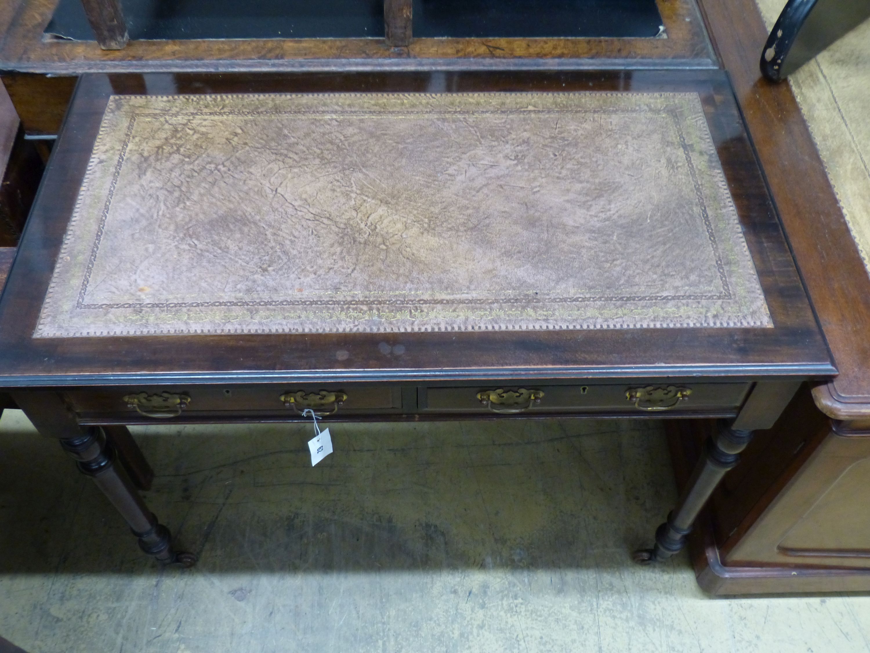 An Edwardian mahogany writing table, length 106cm